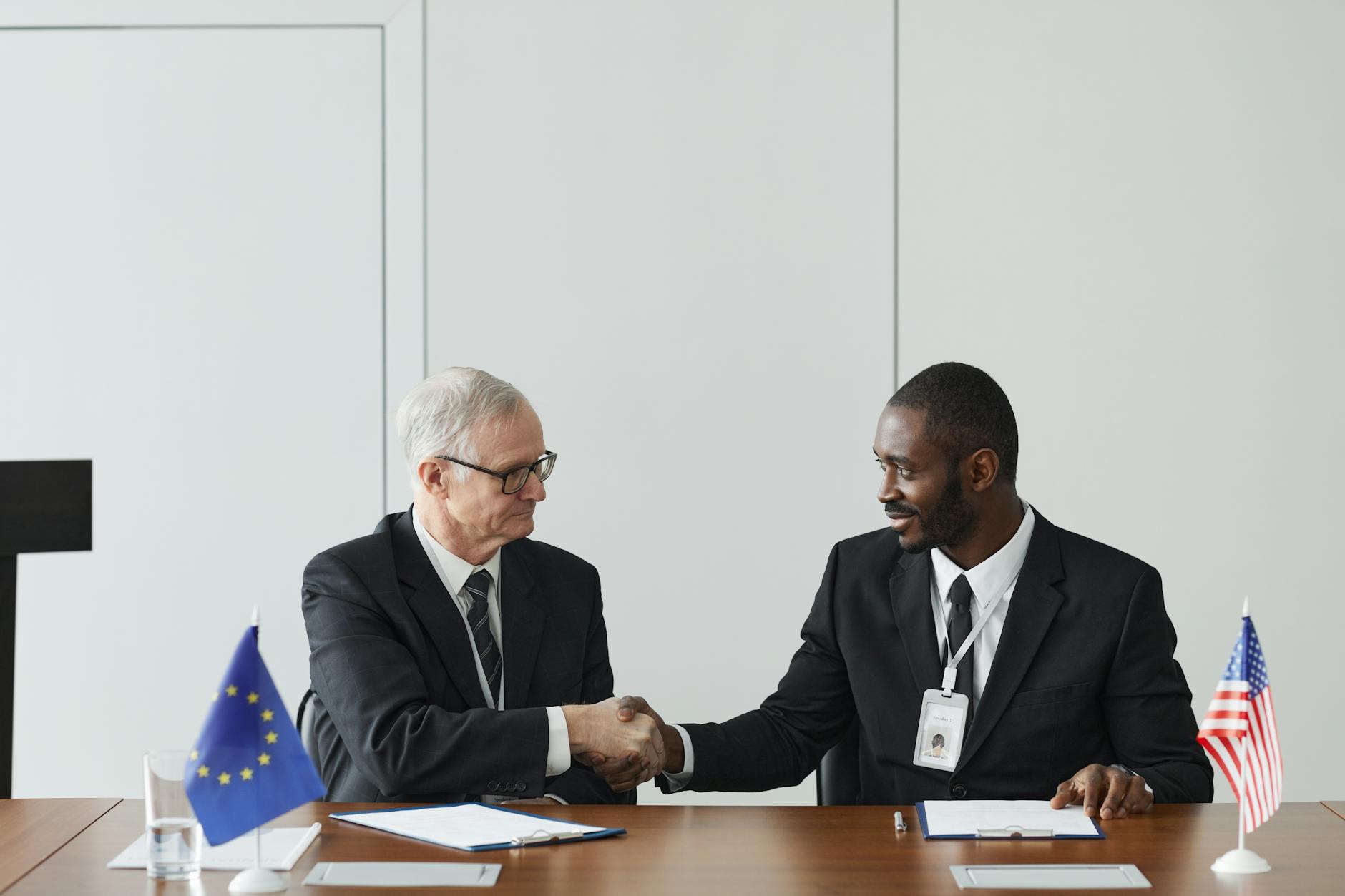 EU and Australian officials sign a joint free trade and defense partnership agreement in Brussels.