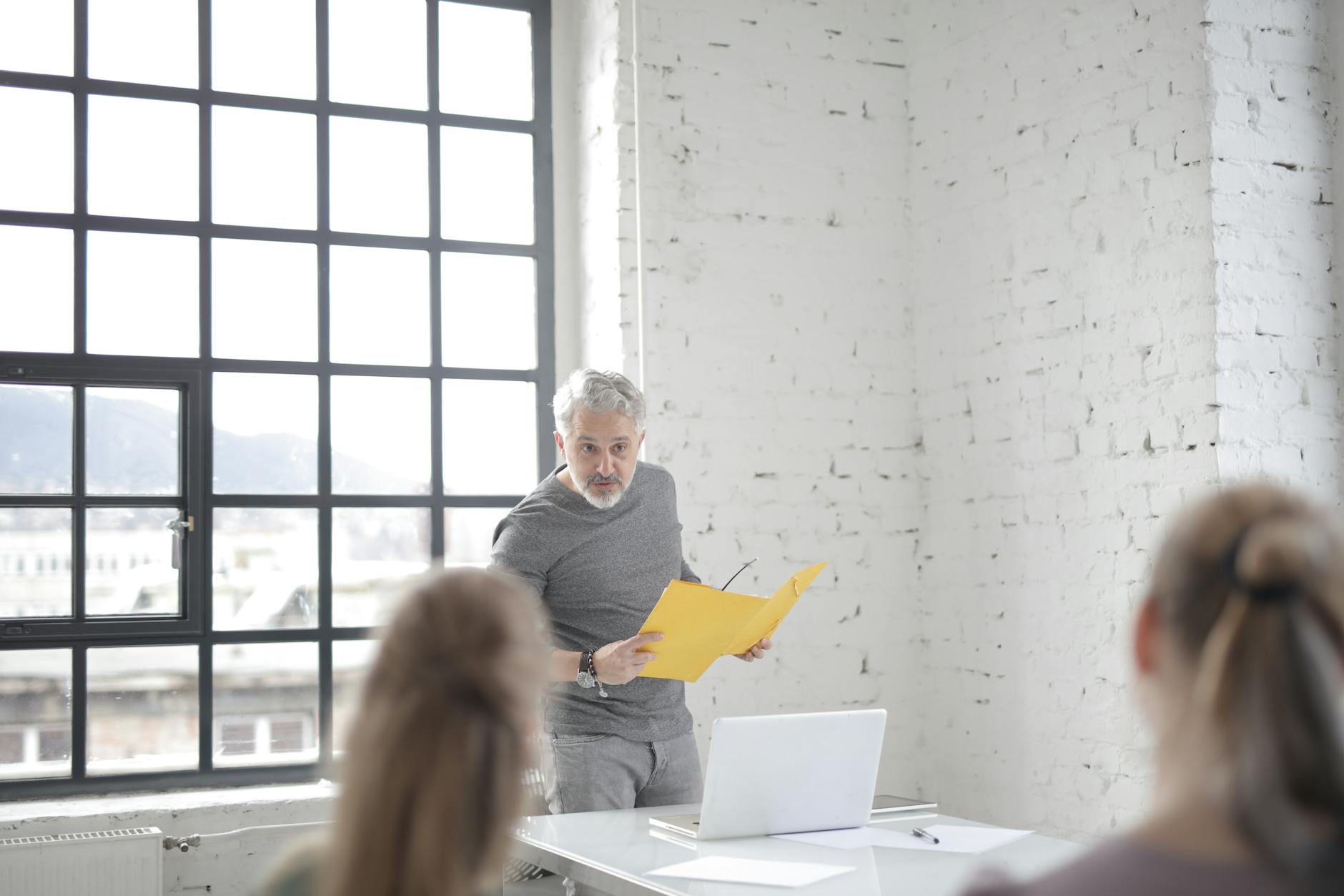 European Union leaders and diplomats sit around a large conference table during emergency talks on the Iran conflict.