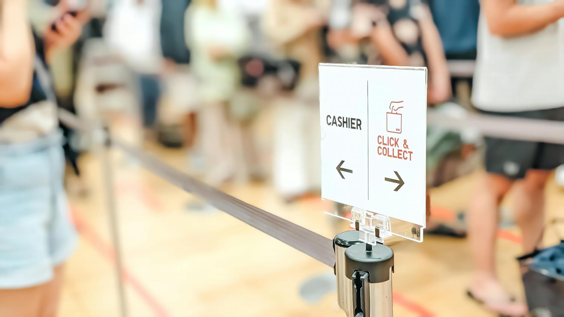 Passengers wait in a long queue near biometric border-control kiosks at a European airport after the EU’s new Entry/Exit System rollout.