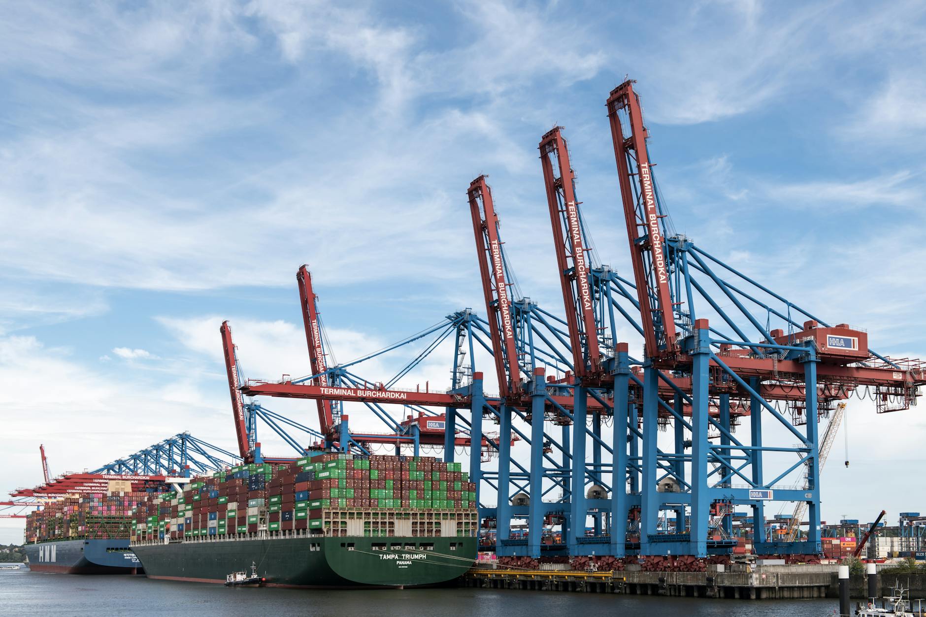 European Union flags outside institutions in Brussels as finance ministers debate a new windfall tax on energy companies during a fresh energy price shock.