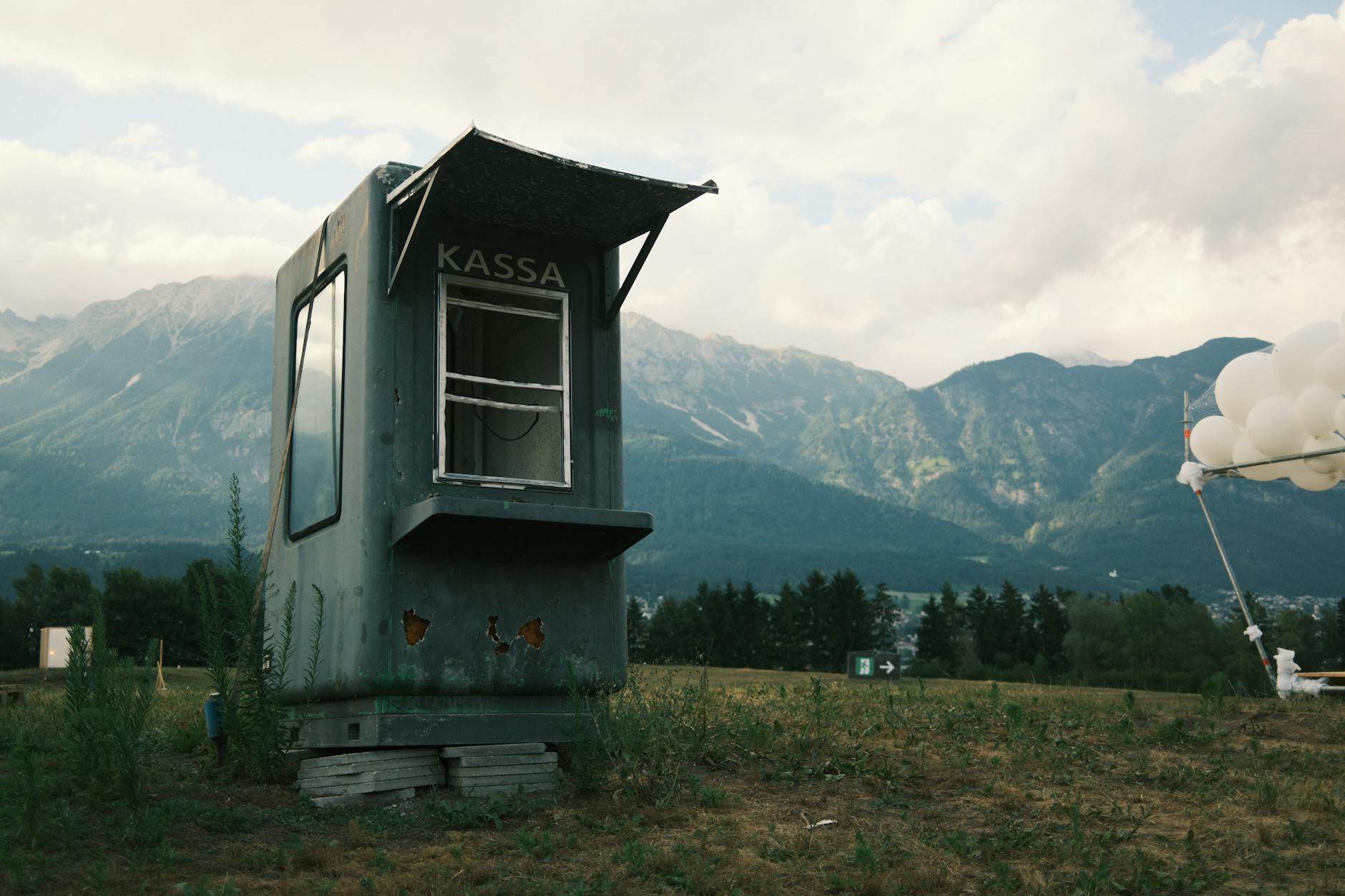 Passengers wait in a long queue near biometric border-control kiosks at a European airport after the EU’s new Entry/Exit System rollout.