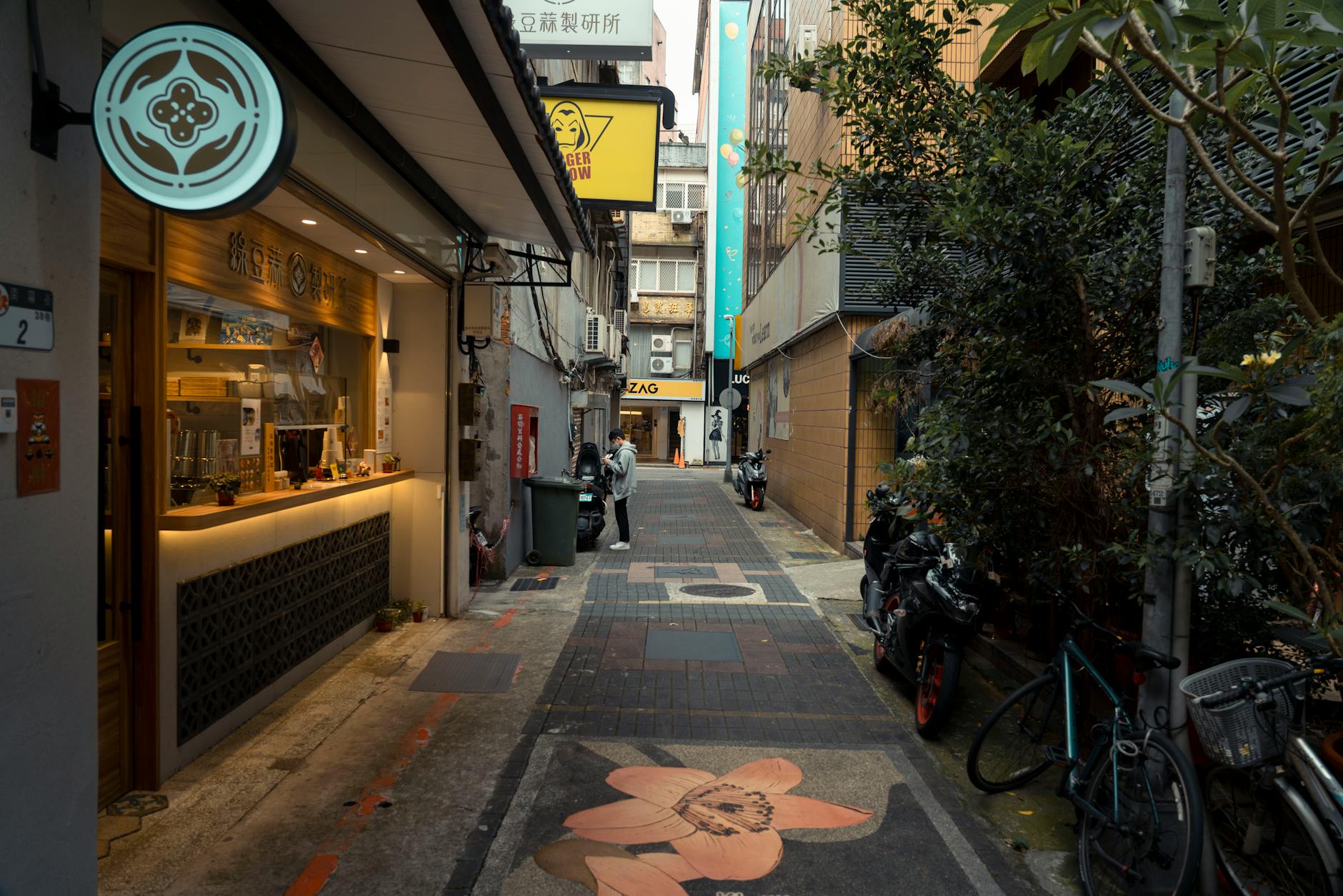 People sit at an outdoor cafe in Rome as Italy’s latest services-sector data signal a contraction in business activity.