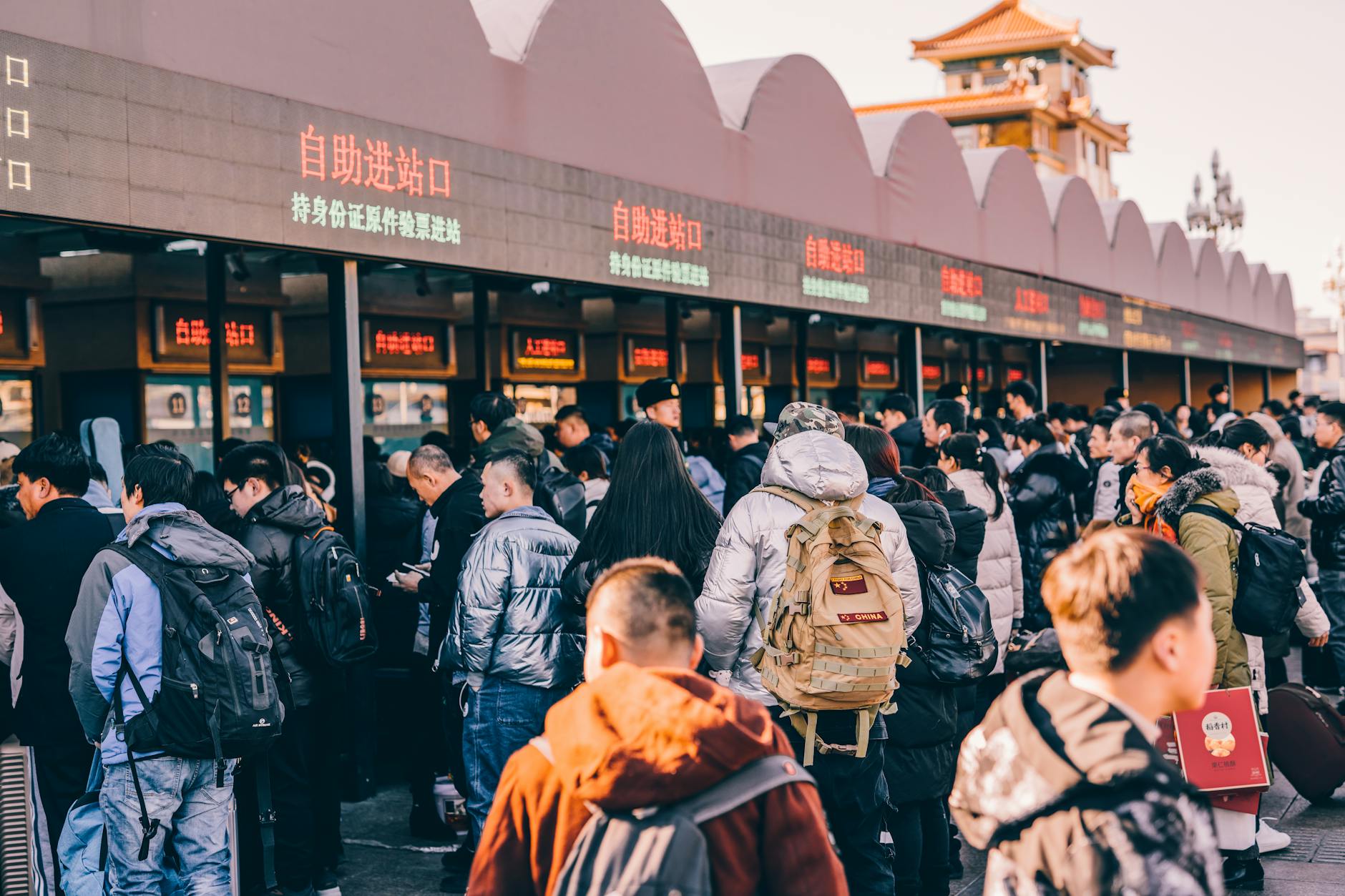 British travellers queue at a European airport passport-control area amid longer border checks.