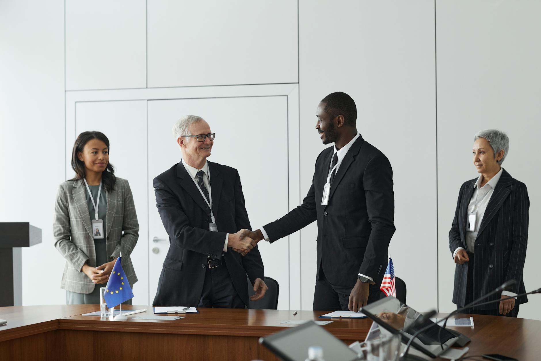 European officials discussing trade measures as auto production lines operate in the background