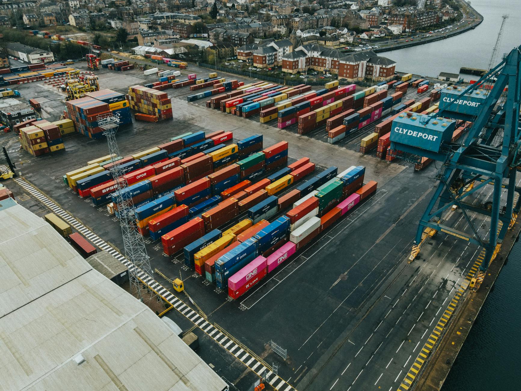 German automotive production line and export vehicles symbolizing trade tensions impact