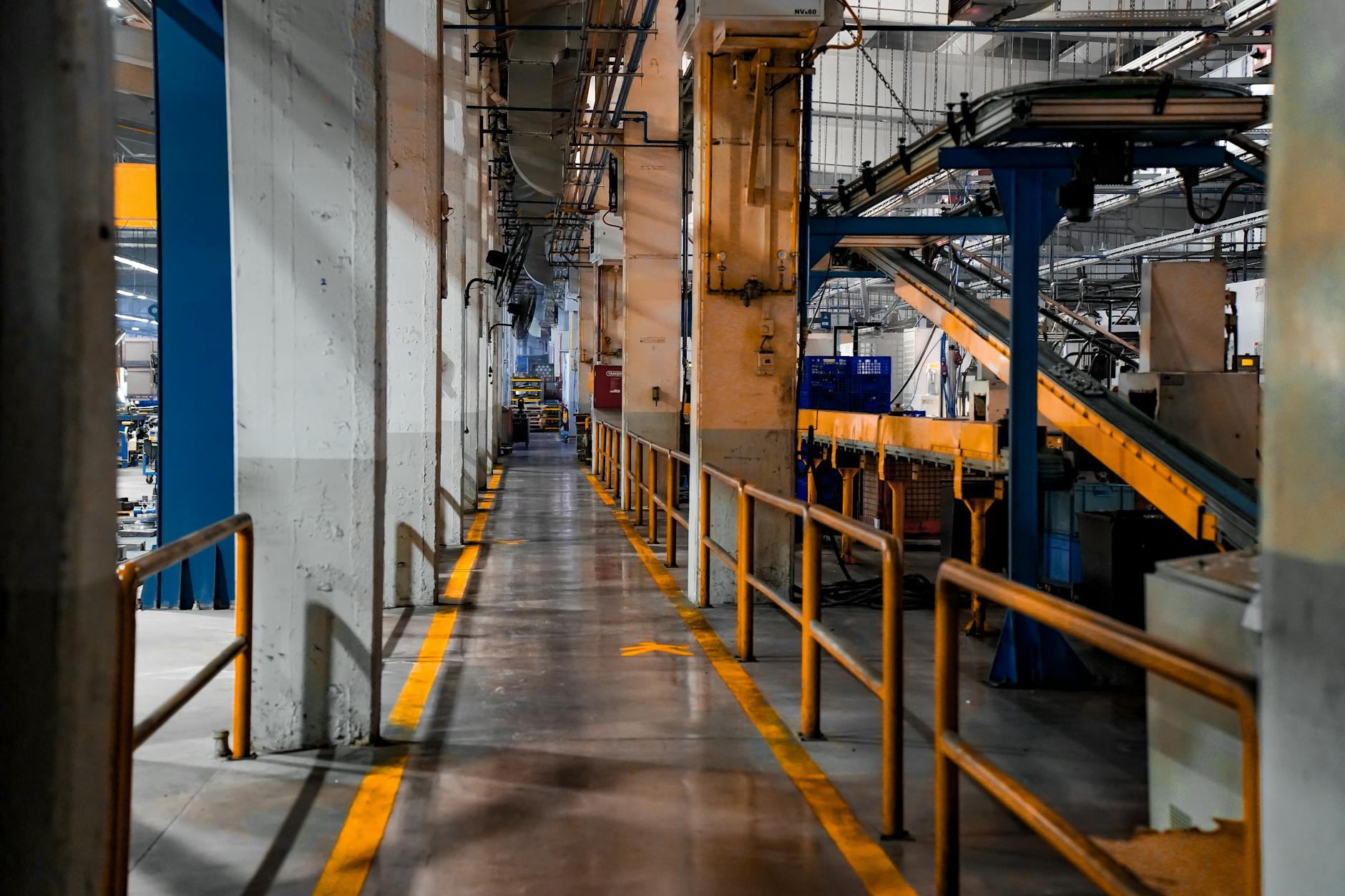 European officials discussing trade measures as auto production lines operate in the background