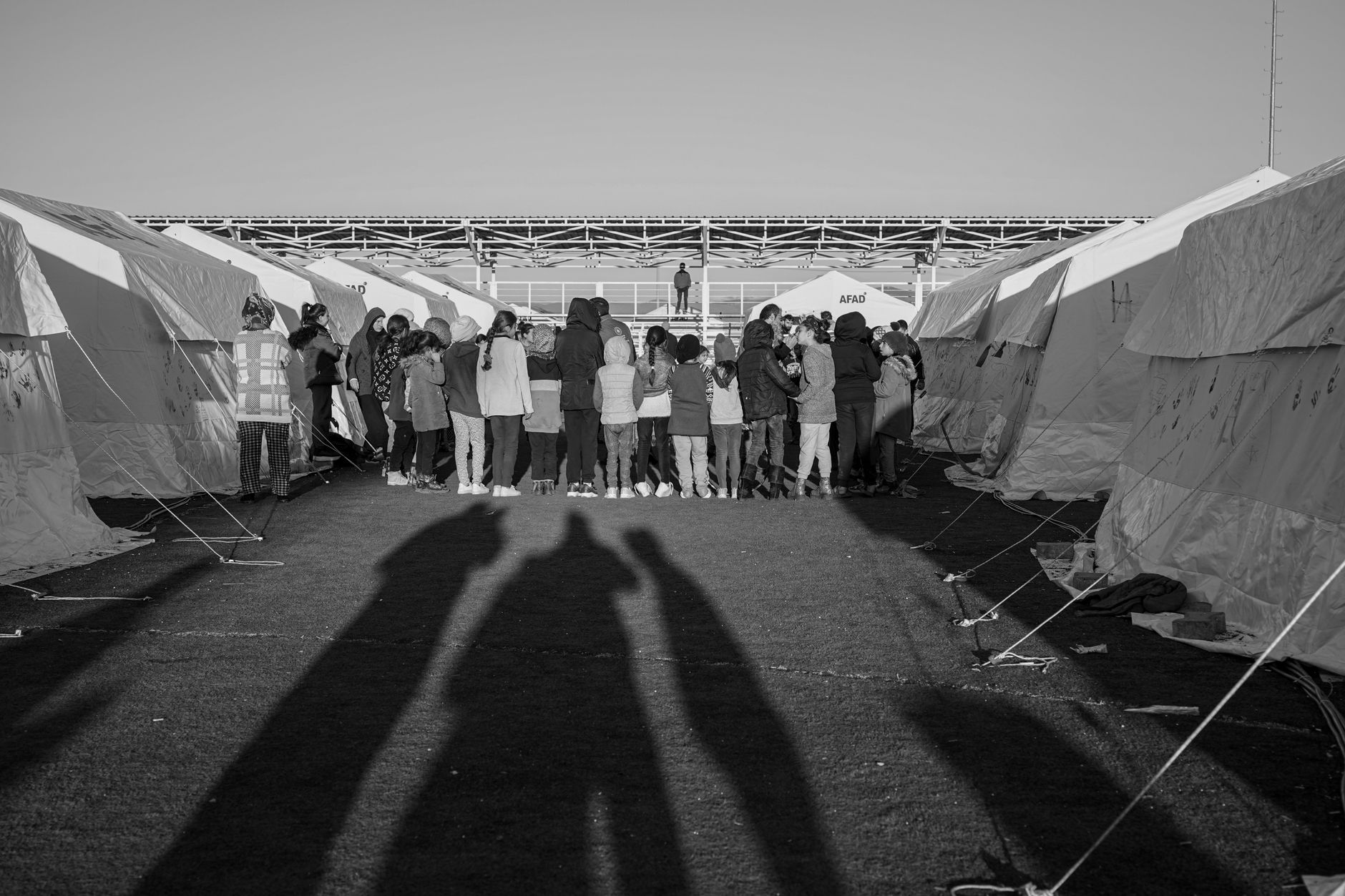 Ukrainian refugees and officials are seen near an EU registration setting as Brussels weighs extending temporary protection to 2028.