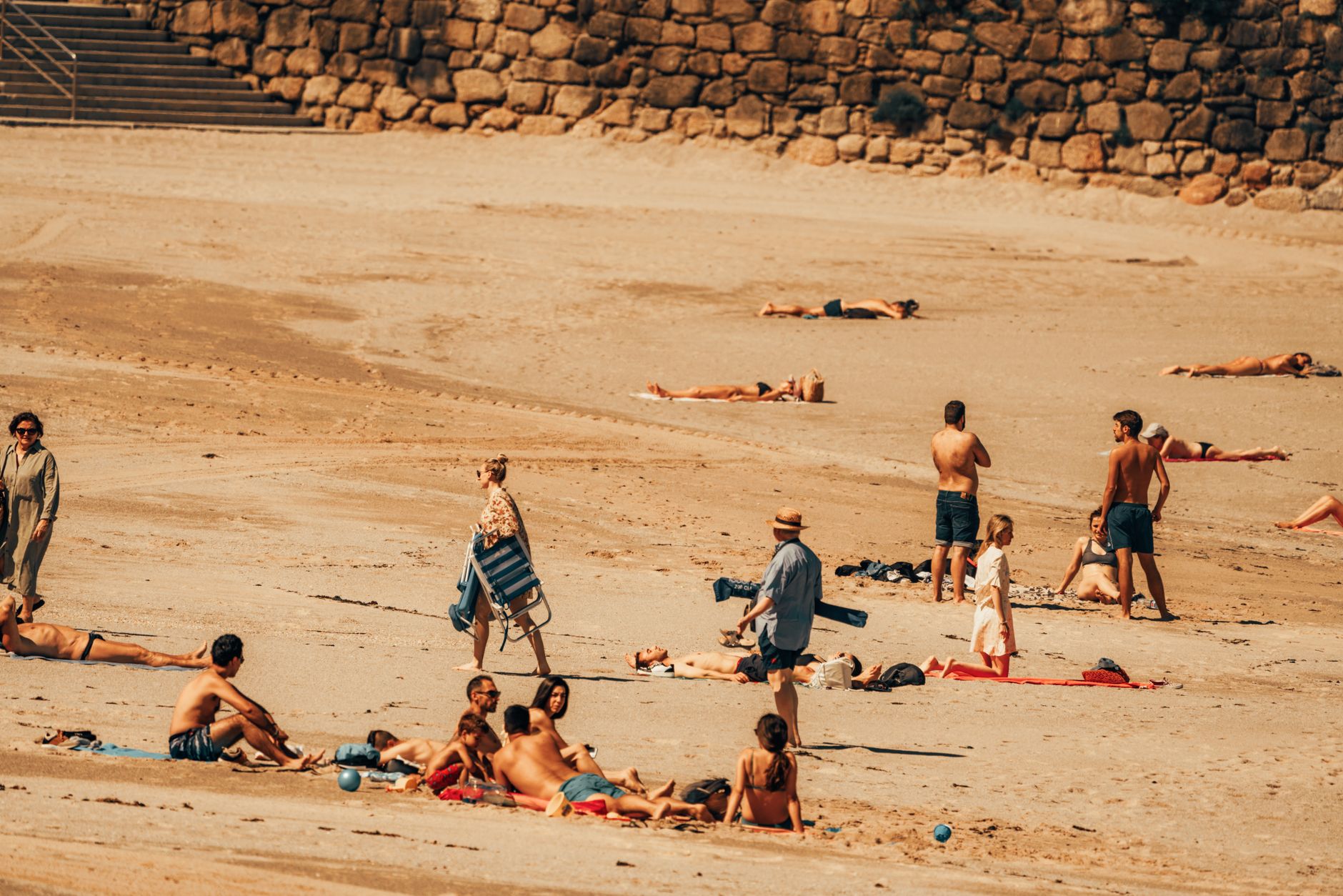 People seek shade and water in a European city during a record-breaking heatwave linked by scientists to human-caused climate change.