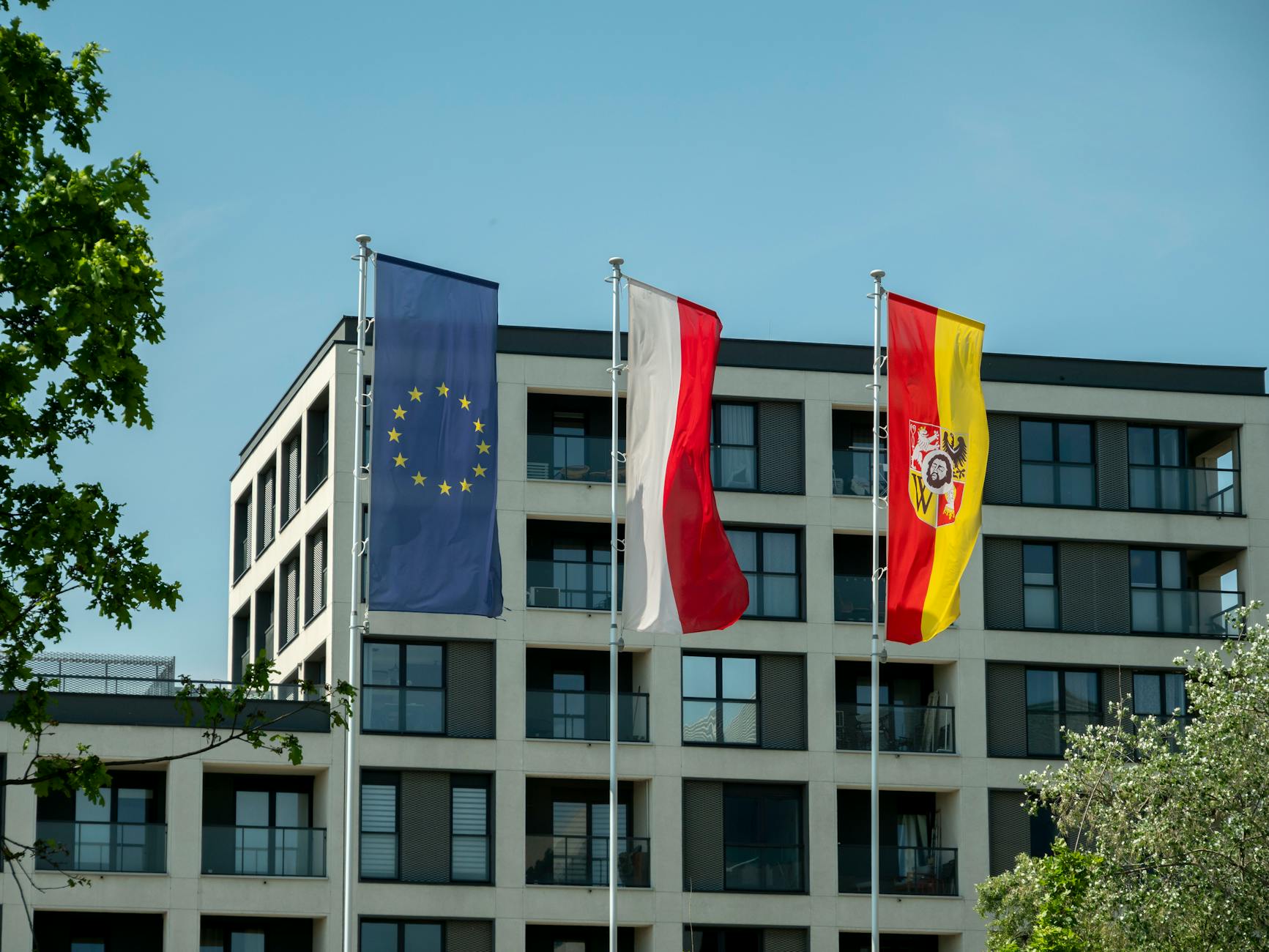 European Union flags and diplomats at a formal accession negotiation meeting