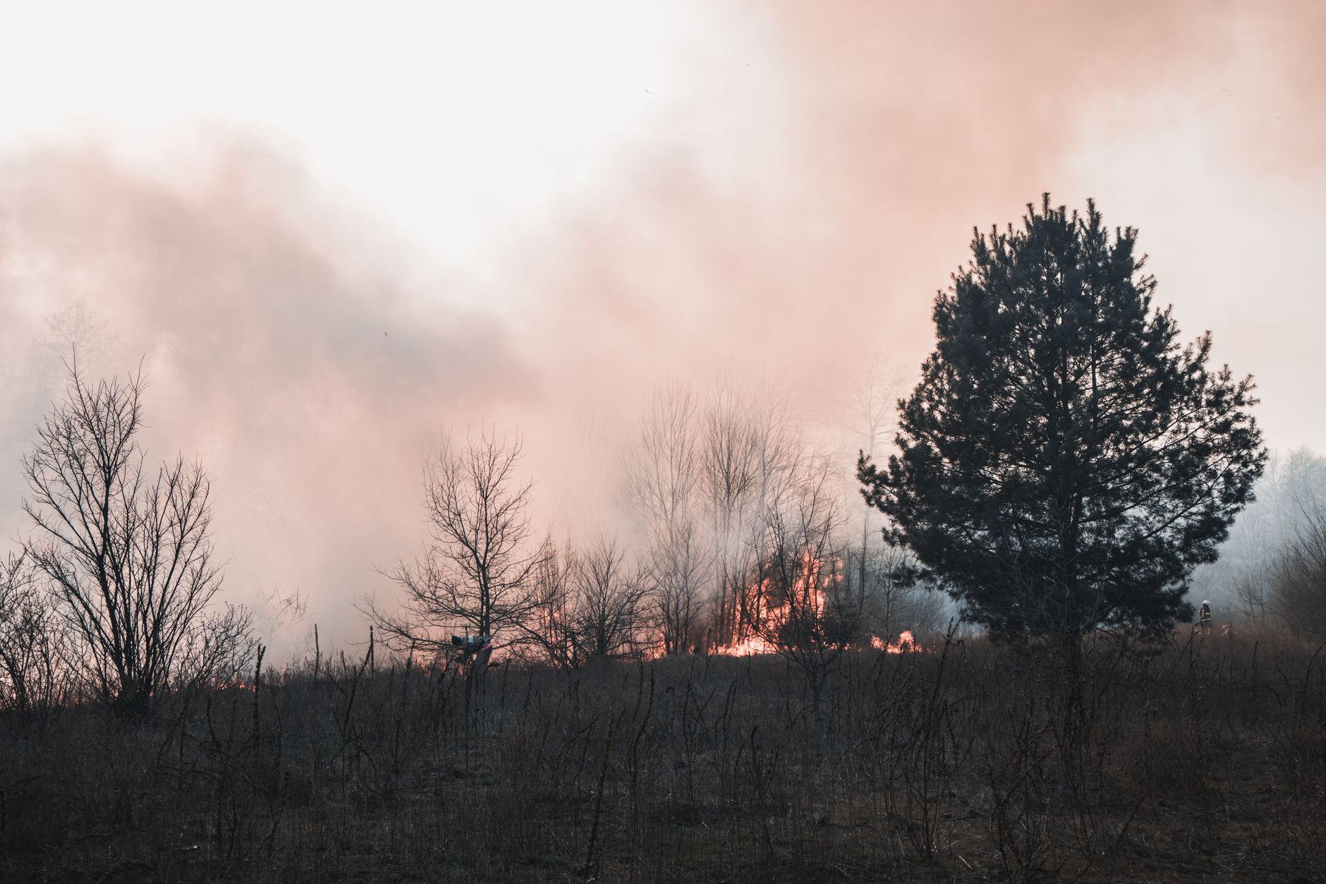 Firefighters confront an advancing wildfire as residents evacuate threatened communities in France and Spain.