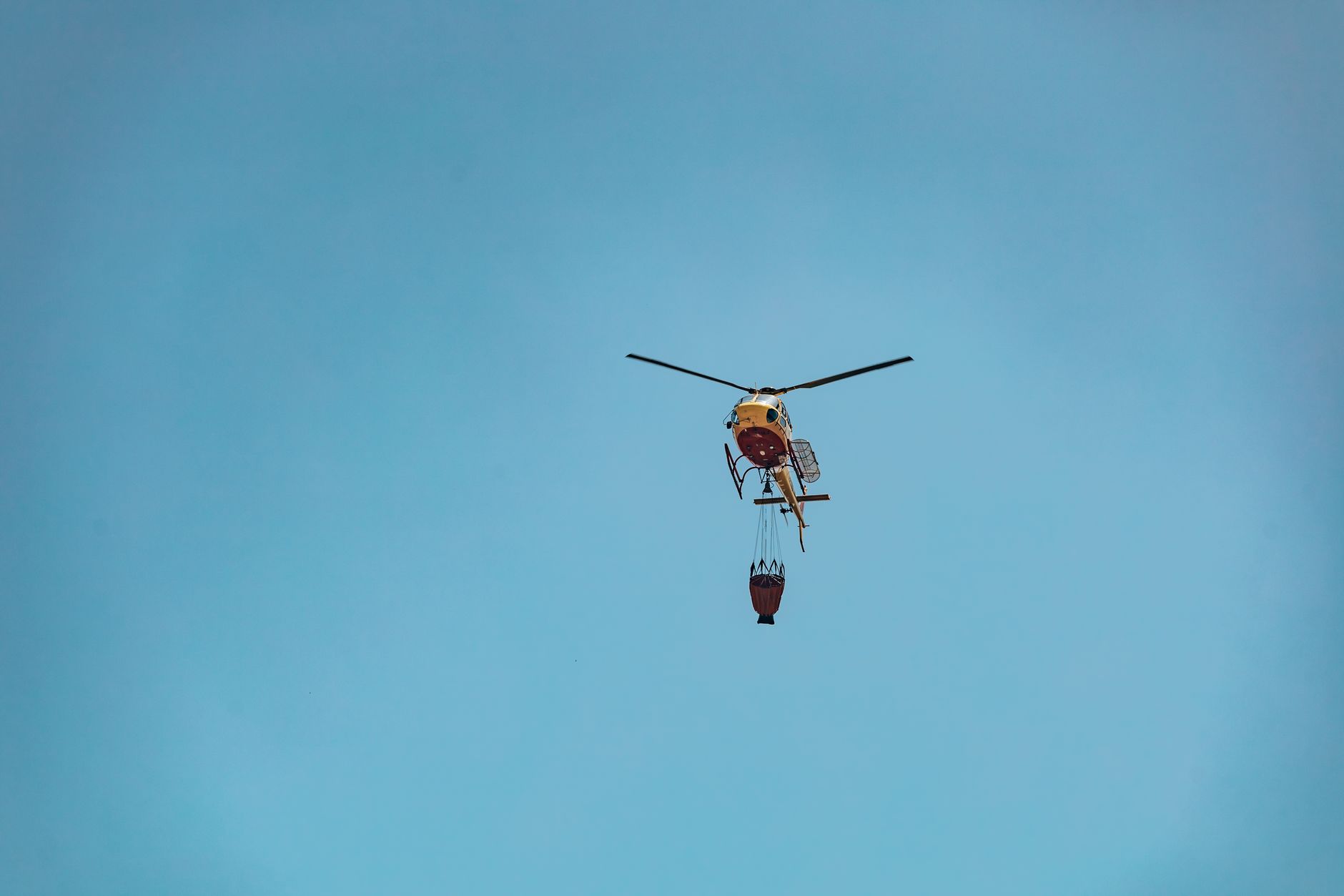 Firefighters confront flames and heavy smoke near evacuated communities in southwestern France.