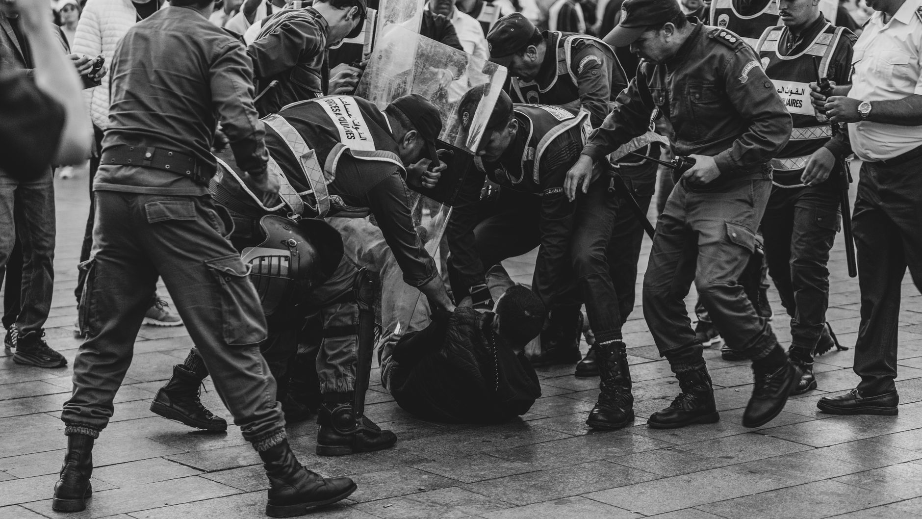 Student demonstrators confront riot police amid smoke and damaged street barriers during anti-government protests in Tirana, Albania, on October 15, 2026.