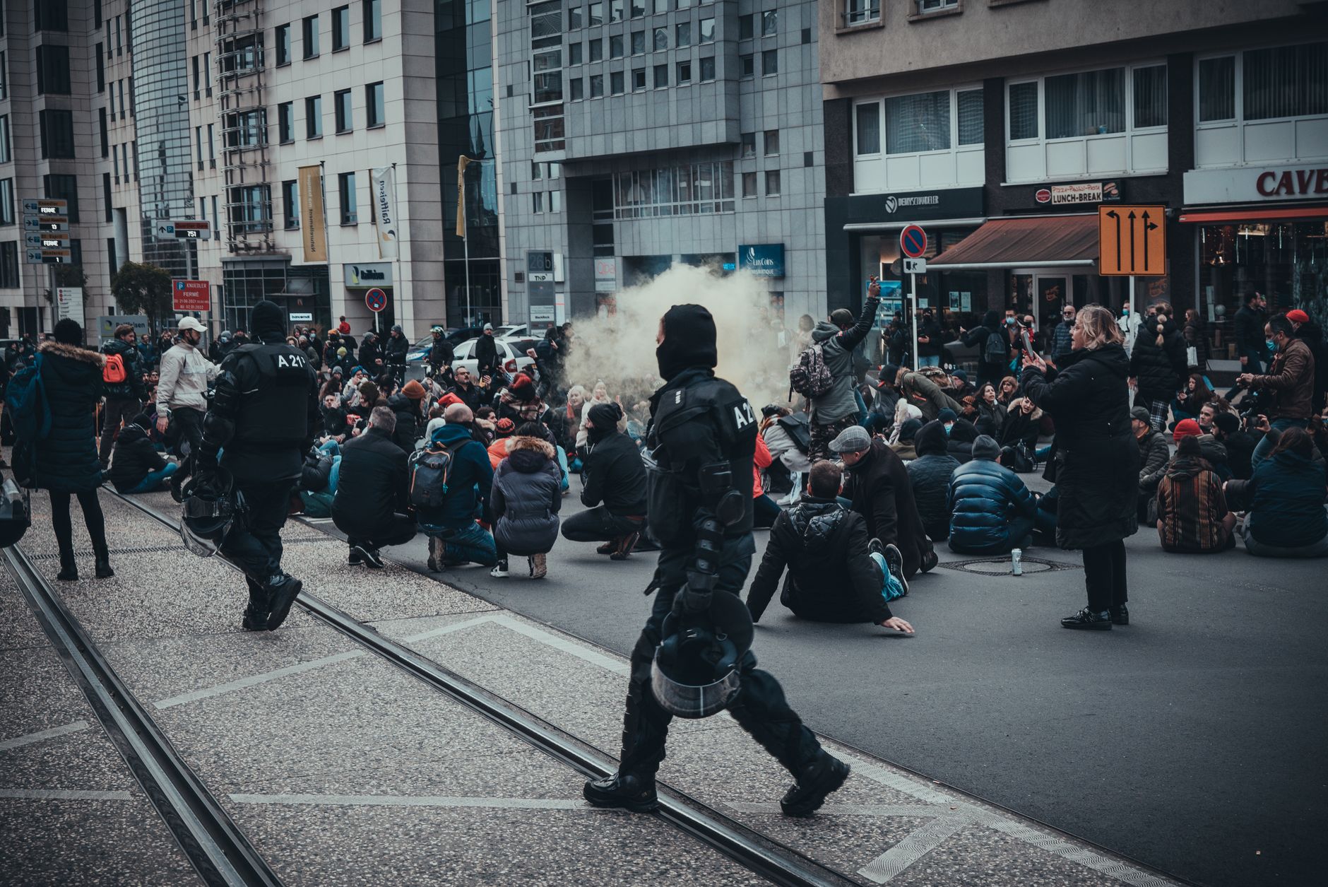 Anti-government demonstrators gather near burning barricades as riot police deploy crowd-control measures in Tirana, Albania, on October 17, 2026.